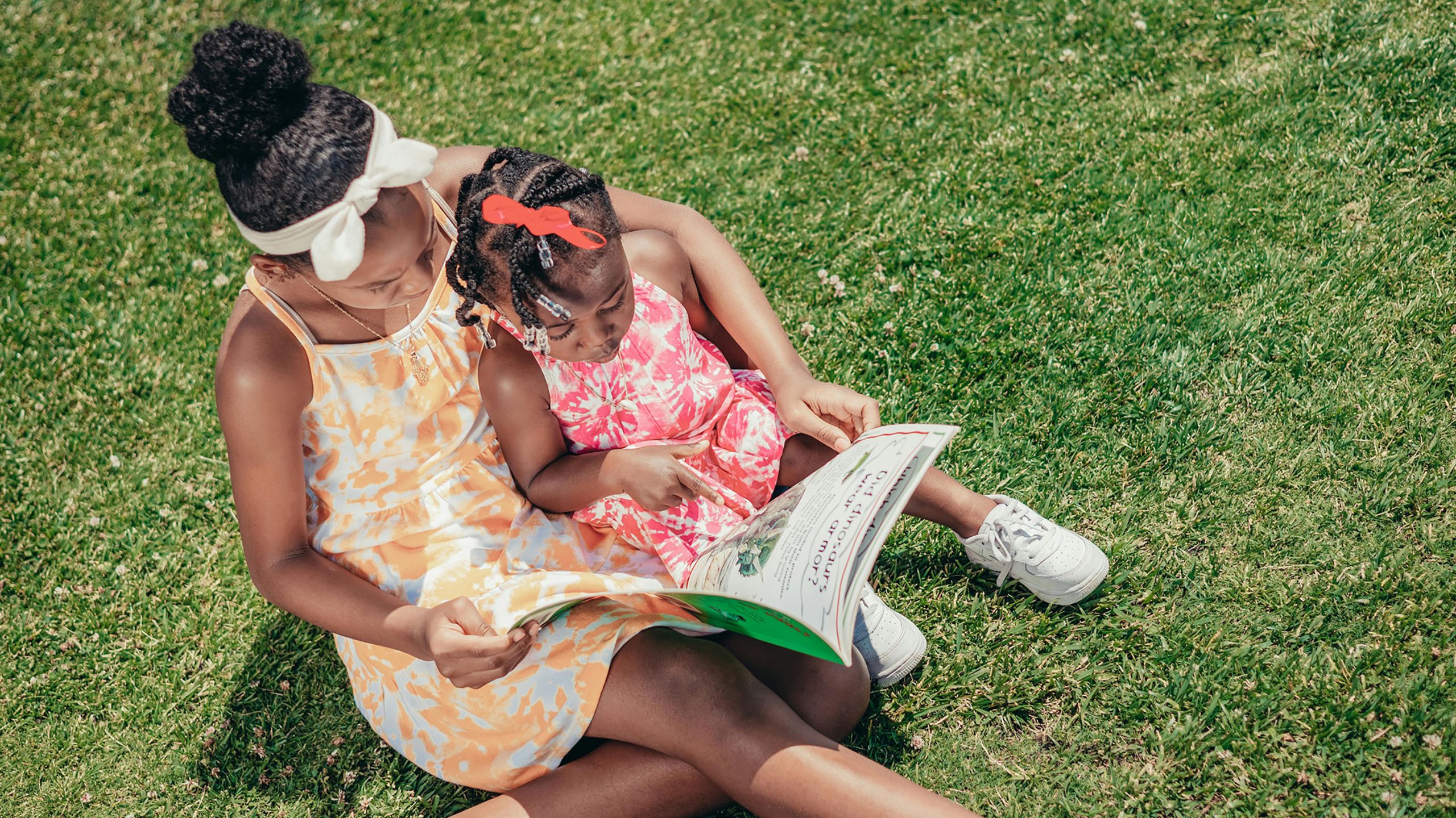 A mom reading to her daughter
