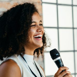 African American woman speaking at a celebration